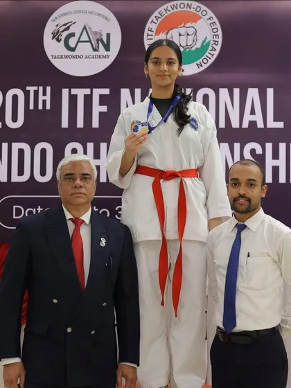 Standing beside my student on the winner's podium at the 20th ITF National Championship. This is what dedication and rigorous competition prep leads to.