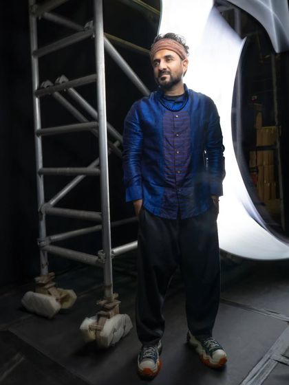 A full-length shot of Vir Das in the beautiful silk kurta by Mandira Bansal. The relaxed fit and rich color were perfect for his stage presence, combining traditional fabric with a modern silhouette.