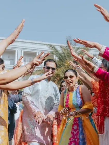 The couple's playful entry into their Haldi celebration. I design these moments to reflect the couple's personality and the fun-loving spirit of the event.