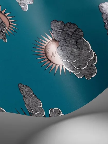 A deep teal version of the Soli e Nuvole wallpaper. This colorway gives the classic Fornasetti print a modern and moody feel, perfect for creating a unique and enchanting space.