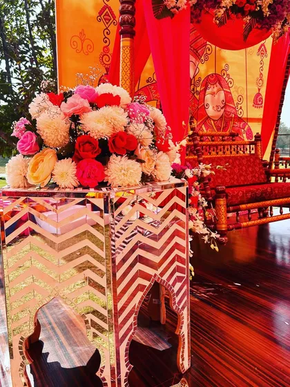 A detail shot from the Rajasthani Mela, showing a mirrored side table next to a traditional swing.