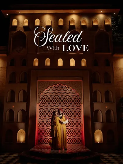 Against the backdrop of regal architecture, we create pre-wedding portraits that are both timeless and majestic. This shot, sealed with love, showcases our passion for using dramatic lighting and stunning locations to tell a powerful love story.