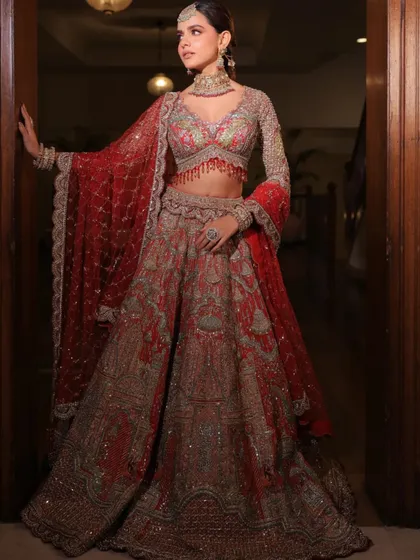 A grand entrance in a traditional red and silver lehenga. I styled this look to feel majestic and powerful, with full-sleeved embroidery and a flowing silhouette perfect for a royal wedding.