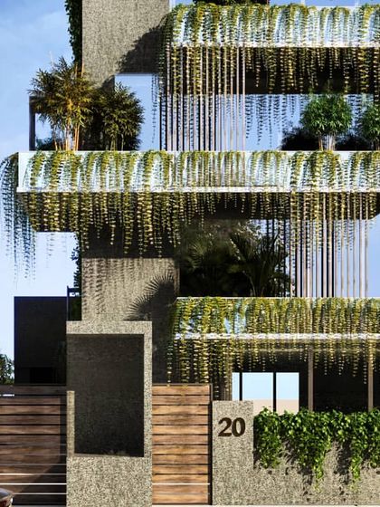 A detailed close-up of the green facade, emphasizing the texture of the building materials and the lush, hanging vegetation.