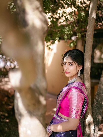A bride looking over her shoulder with a gentle smile, a classic and elegant pose.