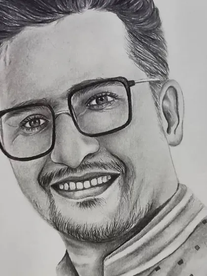 A close-up of the man's face from a couple portrait, showing the detail in his glasses and the texture of his kurta.