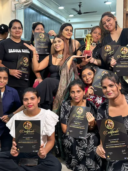 Another group of happy graduates, proudly showing off their certificates.