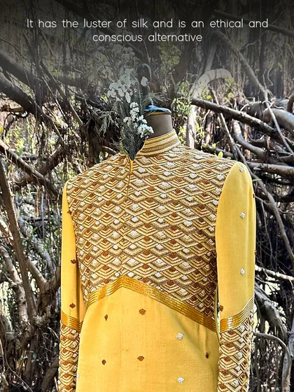 This yellow embroidered garment showcases the beautiful luster of orange fiber fabric, an ethical and conscious alternative to silk that drapes just as beautifully.