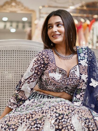 Immerse yourself in a kaleidoscope of colors with this vibrant, intricately embroidered lehenga.