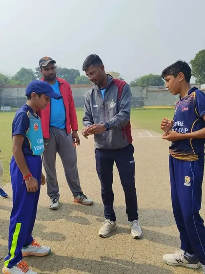A moment of discussion between the umpires and captains before the start of play.