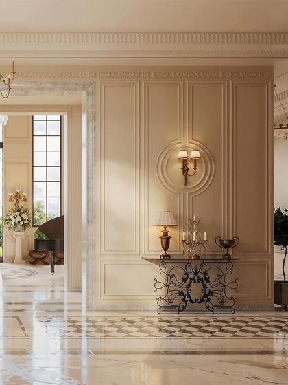 Another perspective of this grand foyer, showcasing the interplay of light and shadow on the paneled walls. The arrangement of furniture and art is deliberate, creating distinct zones within the larger space while maintaining a cohesive and opulent aesthetic.