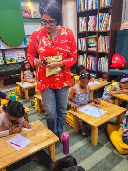 A facilitator guides young artists during our "Doodle Summer Fun" workshop. We create a relaxed environment where kids can learn the basics of doodling without strict rules, just pure creative fun.