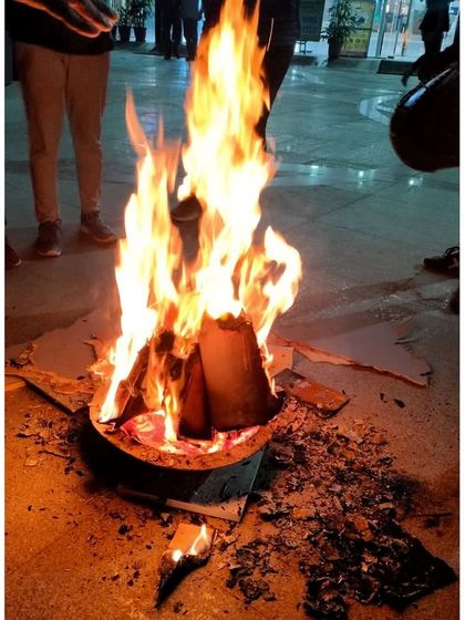 The Lohri bonfire burning bright, symbolizing the warmth and energy of our gym community.