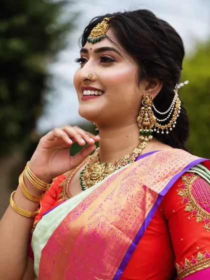 A happy smile is the best makeup! This close-up shows how I balance a glowing, highlighted finish with soft contouring to define features, ensuring the look is both beautiful in person and striking in photographs.