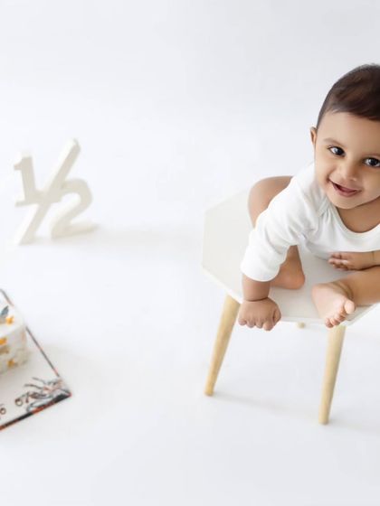 A sweet upward glance from the baby boy. These simple portraits are perfect for capturing their features at this adorable stage.