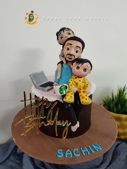 A heartwarming cake for a hardworking dad. This design features a custom topper of him with his two boys, his laptop, and his essential Starbucks coffee. It’s a sweet tribute to a loving father.