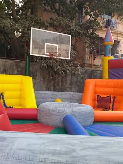 A close-up of the bungee run basketball goal. This adds another layer of competition to the game, as players race to score while attached to the bungee cord.