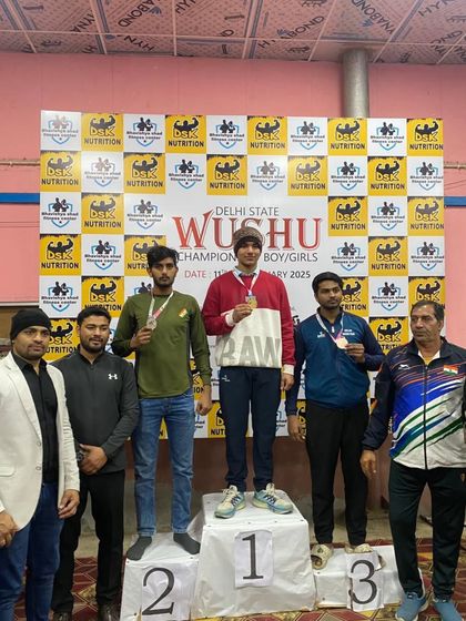 One of our Wushu fighters on the number one spot of the podium at the Delhi State Wushu Championship.