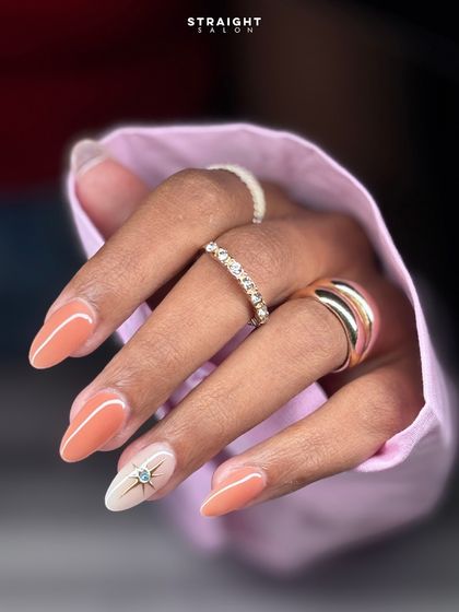 A close-up of the peach set, showing the beautiful star and gold accent nail. It's a perfect way to add a touch of glam to a simple color.