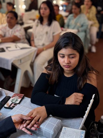 Paint your path to success. A student deeply focused during a practical session at our nail art school in Bangalore.