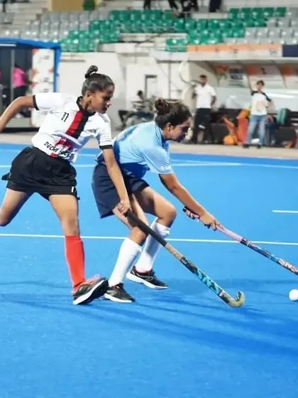 Intense one on one action during the Khelo India Women's Hockey League. My players are trained to be aggressive on the ball and relentless in their pursuit of victory, seen here in a tough tackle.
