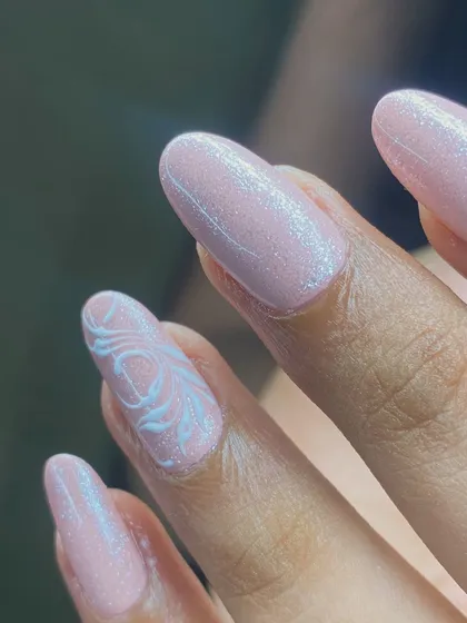 Art is not what you create, art is what creates you. Delicate white swirls on a shimmery pink base.
