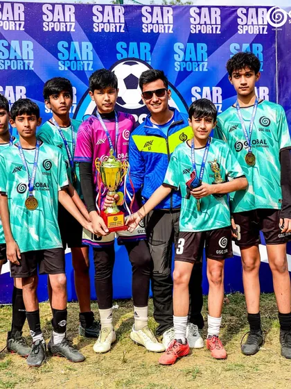 The U13 runners-up team proudly holds their trophy, a testament to their hard-fought journey in the Pride Cup.