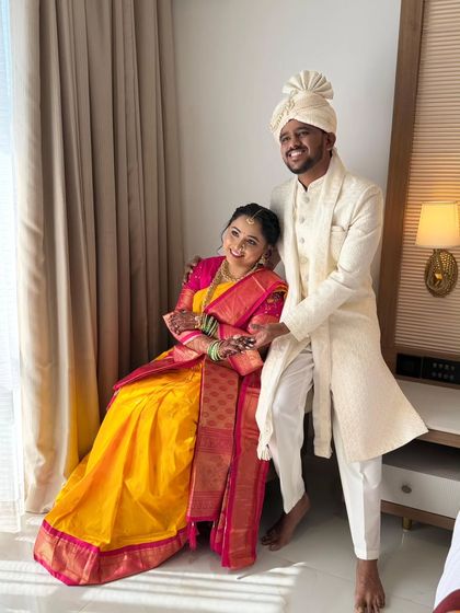 A lovely portrait of the Maharashtrian bride and groom. Her makeup is soft and elegant, harmonizing beautifully with her vibrant saree and his classic attire.