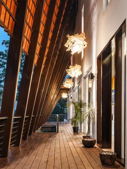 At Tellado Villas, this semi-open passageway is where structure and nature meet. The rhythmic wooden beams and warm, ambient lighting create a tranquil transition, demonstrating our focus on crafting experiences, not just buildings.