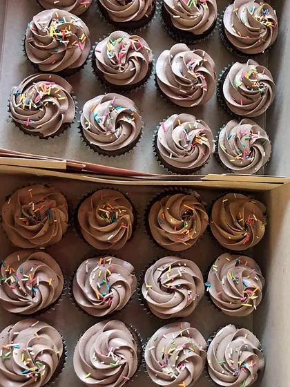 More boxes of our popular chocolate birthday cupcakes getting ready for a bulk order. They are a convenient and crowd-pleasing option for any party.