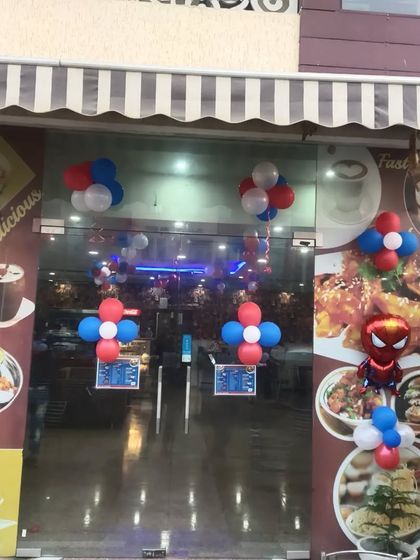Simple yet effective Spiderman-themed balloon decorations for a cafe entrance. This shows how I can theme any space, big or small.