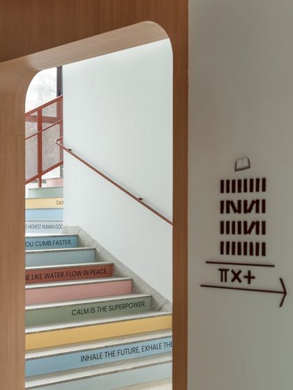 A close-up of the "stairway of values," where each step is inscribed with a positive affirmation or quote. This detail turns the simple act of climbing stairs into a moment of reflection and encouragement.