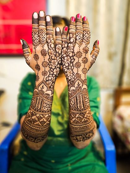 A playful pose showing off the intricate details of this floral vine design.