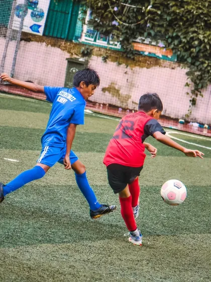 Two players locked in an intense 1v1 battle for the ball during the Independence Cup. This action shot captures the competitive spirit and determination we instill in our teams.