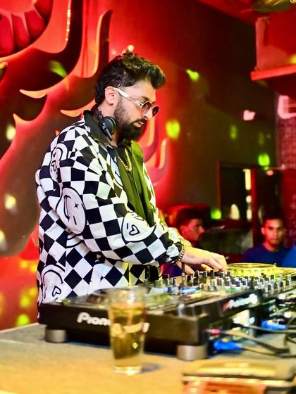 In my element at Tipsy Bull, surrounded by the club's unique graffiti art.