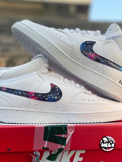 A close-up of the galaxy pattern on the Nike swoosh, showing the detailed star splatters.