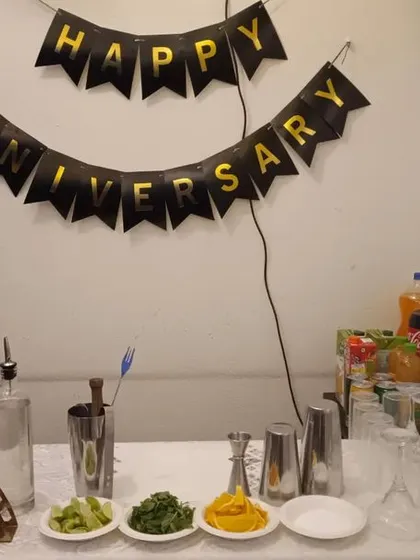 Celebrating a special anniversary at home. We set up this intimate bar counter, complete with glassware, garnishes, and a professional bartender to make the evening perfect.