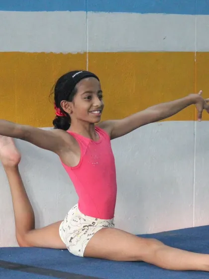 A beautiful split pose on the floor, showcasing excellent flexibility and form. We focus on the fine details that make a pose look effortless.