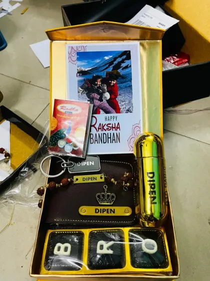 Another beautiful Rakhi hamper option, this one features a personalized wallet, a custom name perfume, 'BRO' chocolates, and a special photo card to celebrate your bond.