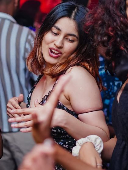 A partygoer lost in the music on the dance floor at Toca Brigade.