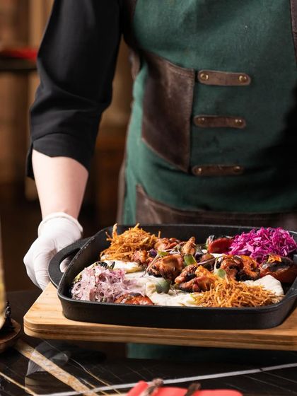 Our Turkish chicken wings, served fresh and sizzling from the kitchen. Each platter is a carefully composed dish, ready to be enjoyed in our opulent dining space.