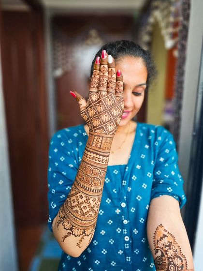 A playful pose showing off the intricate details on the back of the hand and arm.