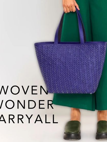 Our Woven Wonder Carryall in a vibrant purple. Meticulously crafted from premium leather, its interwoven pattern exudes a timeless elegance.