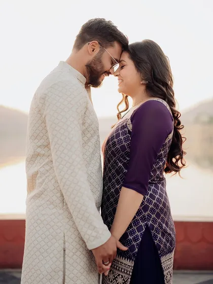 A tight, intimate portrait of the couple at Jal Mahal. This close-up shot focuses purely on their loving expressions and connection.