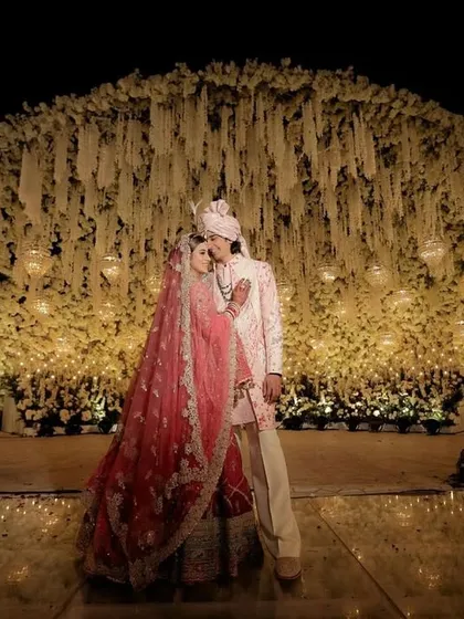 A moment of forever, framed by a spectacular dome of cascading white florals. I design these larger than life backdrops to make your most cherished memories feel as magical as a fairytale.