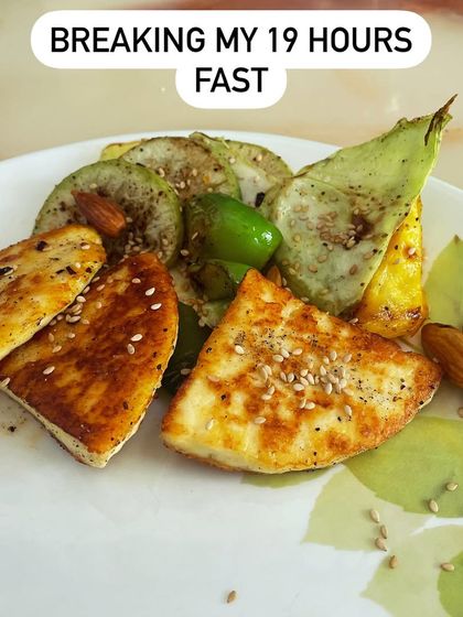 This is what I eat to break a 19-hour fast: pan-fried paneer with grilled vegetables and nuts. The first meal should be nutrient-dense, focusing on protein and healthy fats to replenish your body without spiking your blood sugar.