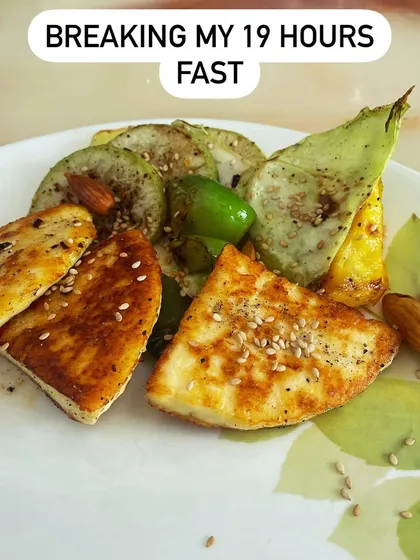 This is what I eat to break a 19-hour fast: pan-fried paneer with grilled vegetables and nuts. The first meal should be nutrient-dense, focusing on protein and healthy fats to replenish your body without spiking your blood sugar.