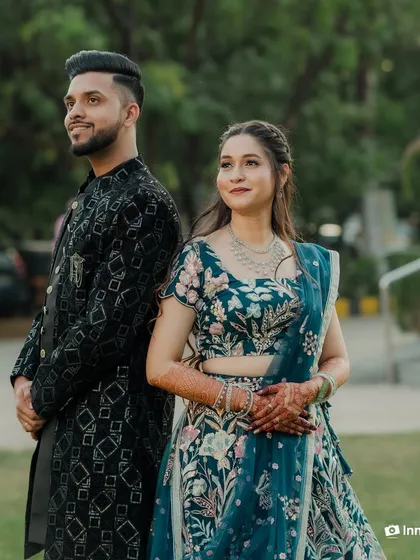 This series of photos captures a stylish couple during their Sangeet. From a romantic forehead kiss to playful poses, these shots showcase their beautiful coordinated outfits and happy connection.