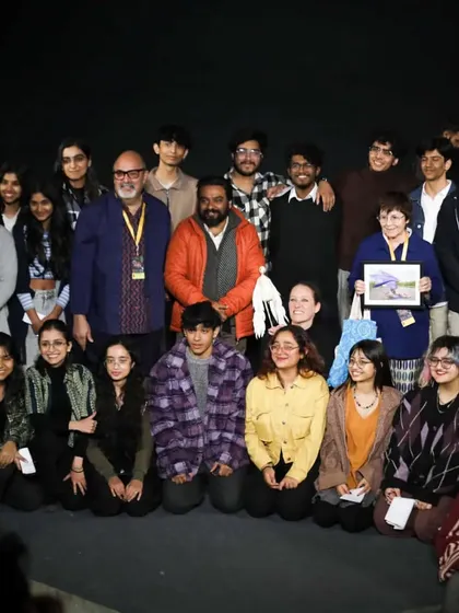 The French performer of 'Wings & Roots' poses with our founder and a group of enthusiastic students after the show.