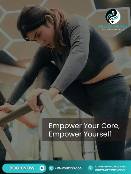 Empower your core, empower yourself. This client is using the Cadillac to perform a challenging stretch that also engages the core muscles for stability and control.